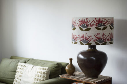 Grecian lamp base in Grizzly Brown with IA Design shade in Pohutukawa design.